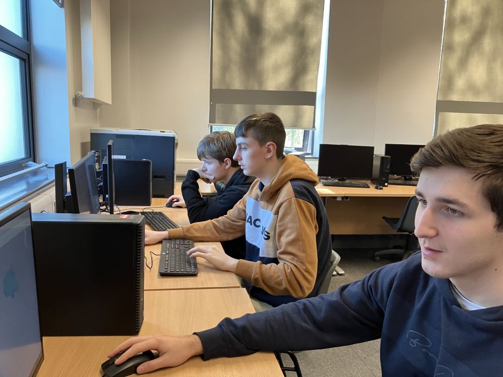 Students at work on computers to complete the tasks in the CAD competition