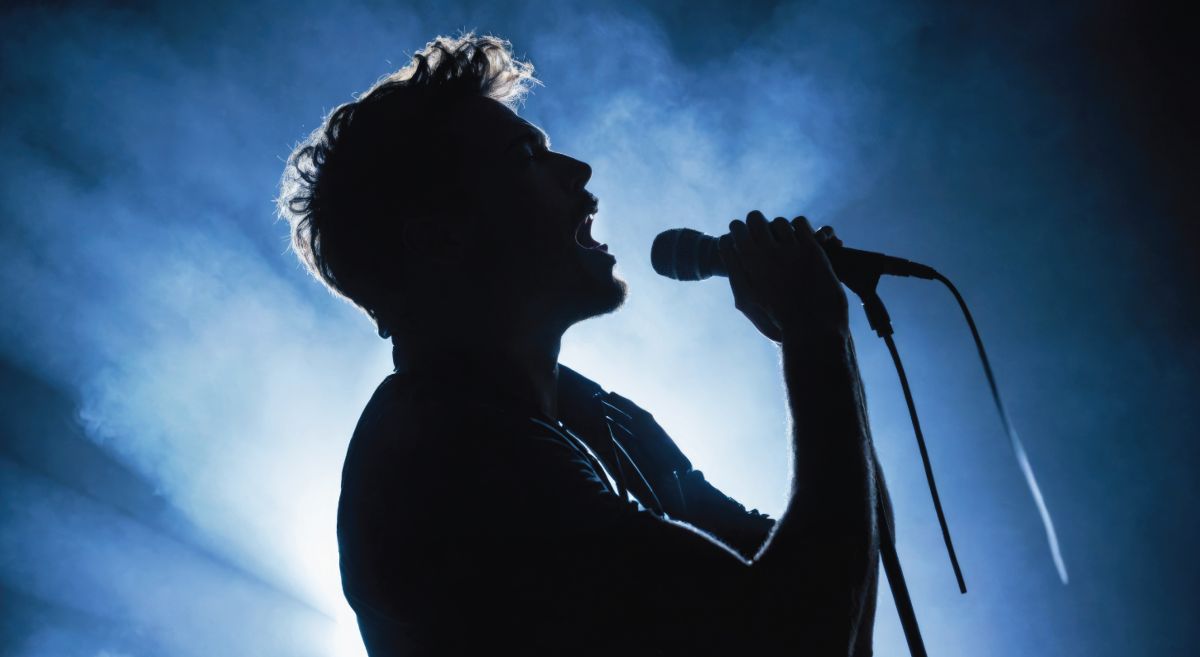 Silhouetted image of a male vocalist