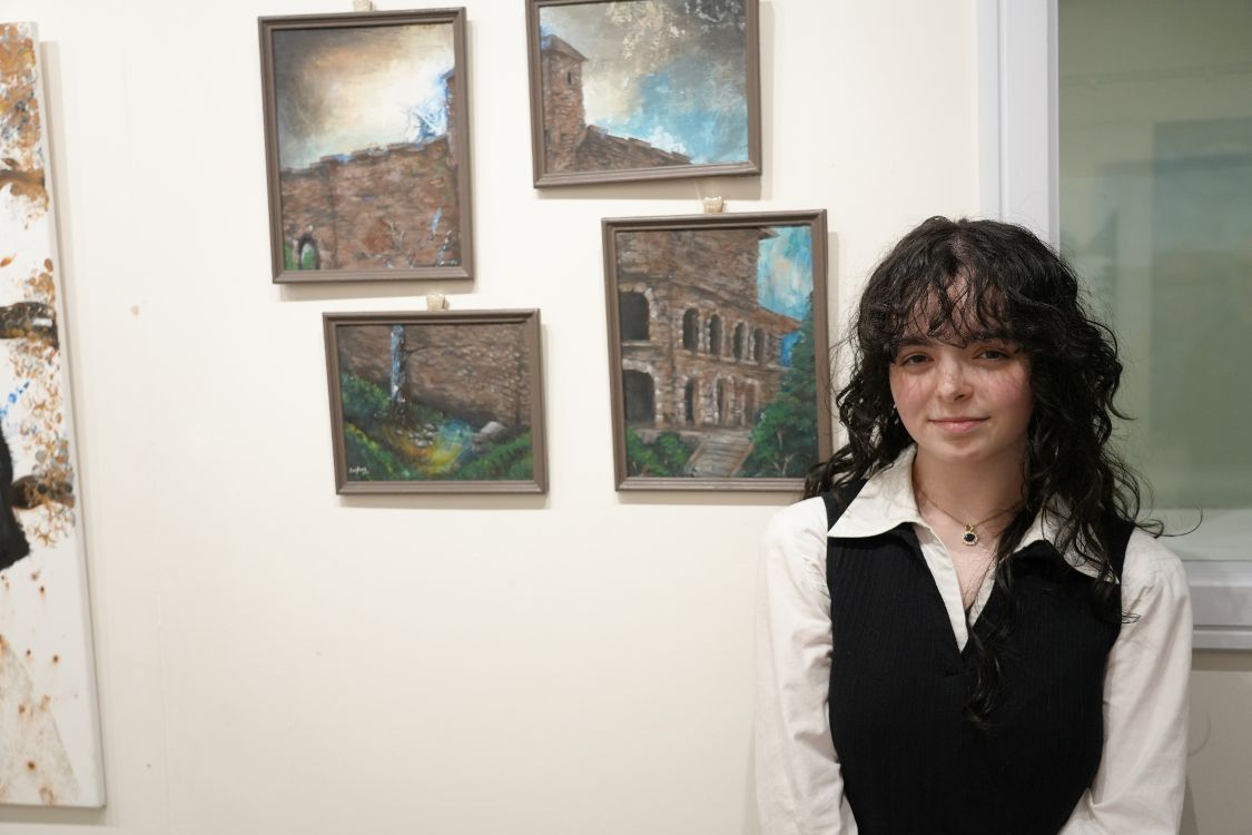 Student Mary-Ellen McLoughlin with her work which is displayed in the exhibition