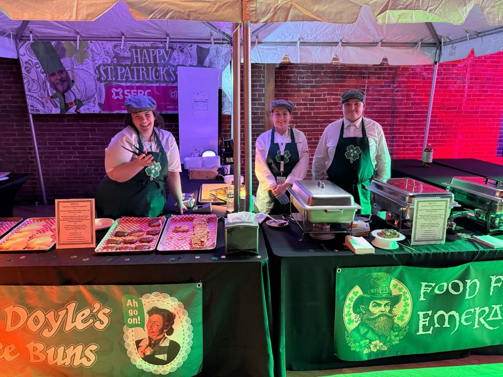 Lucy Boal, Rebekah McMullan and Levi McShane prepare for visitors to the St Patrick’s Day Festival in Nashville.
