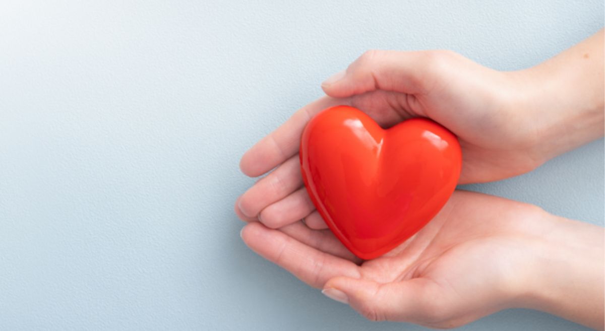 Picture of a person holding a cartoon heart