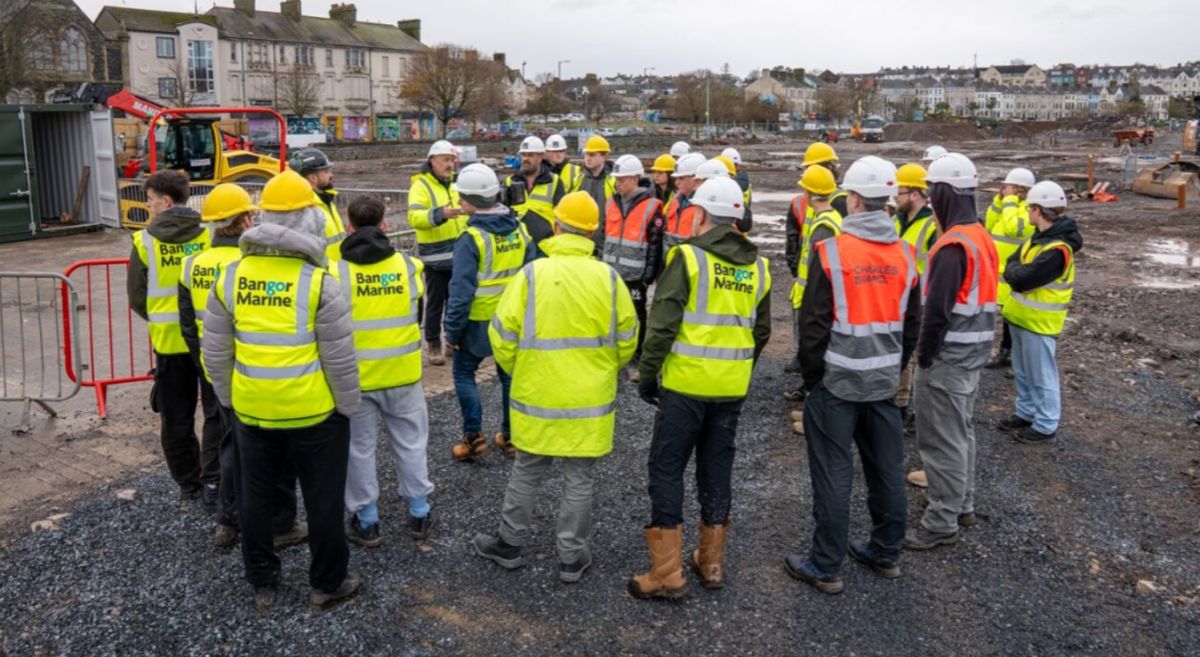 Picture of construction students at Bangor Marine construction project. 