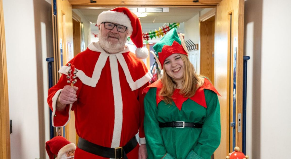 Picture of a student with santa claus