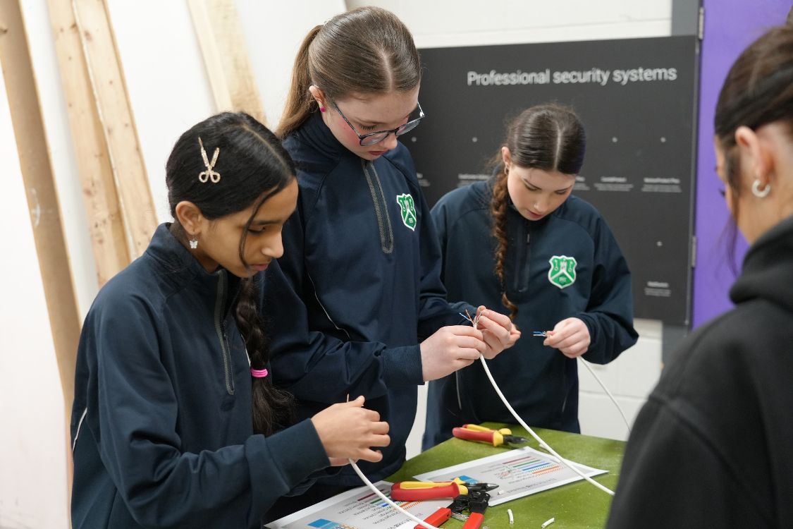 Students try out fire and security systems.