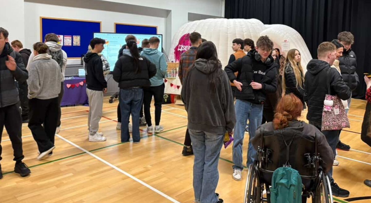 Picture of staff and students at a love your college event