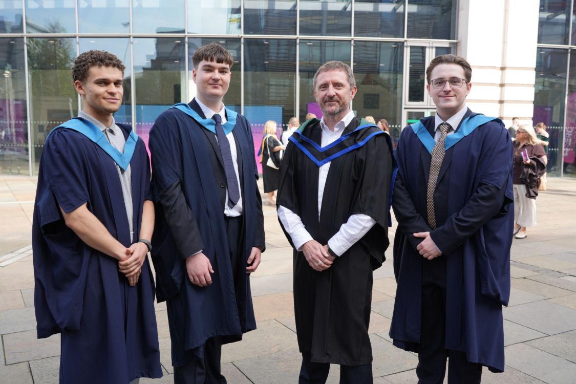 Graduates with Tommy Martin 