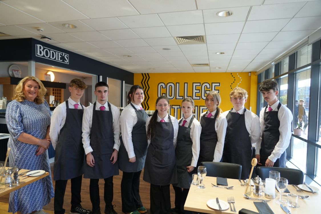 Hospitality Lecturer Sinead Scott with Level 2 Traineeship in Hospitality students