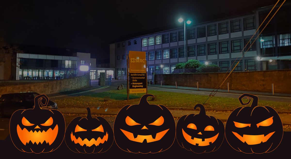 Picture of Ards campus at night with Halloween Pumpkins in the foreground. 