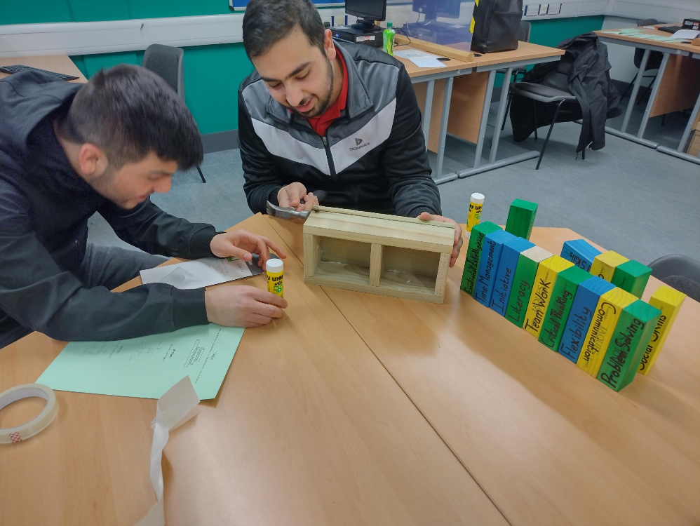 two students assembling bird box