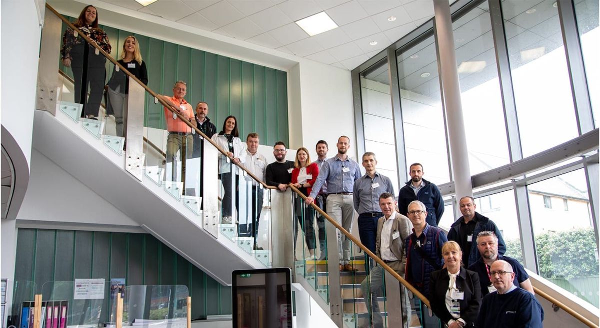 Group of people pictured on staircase