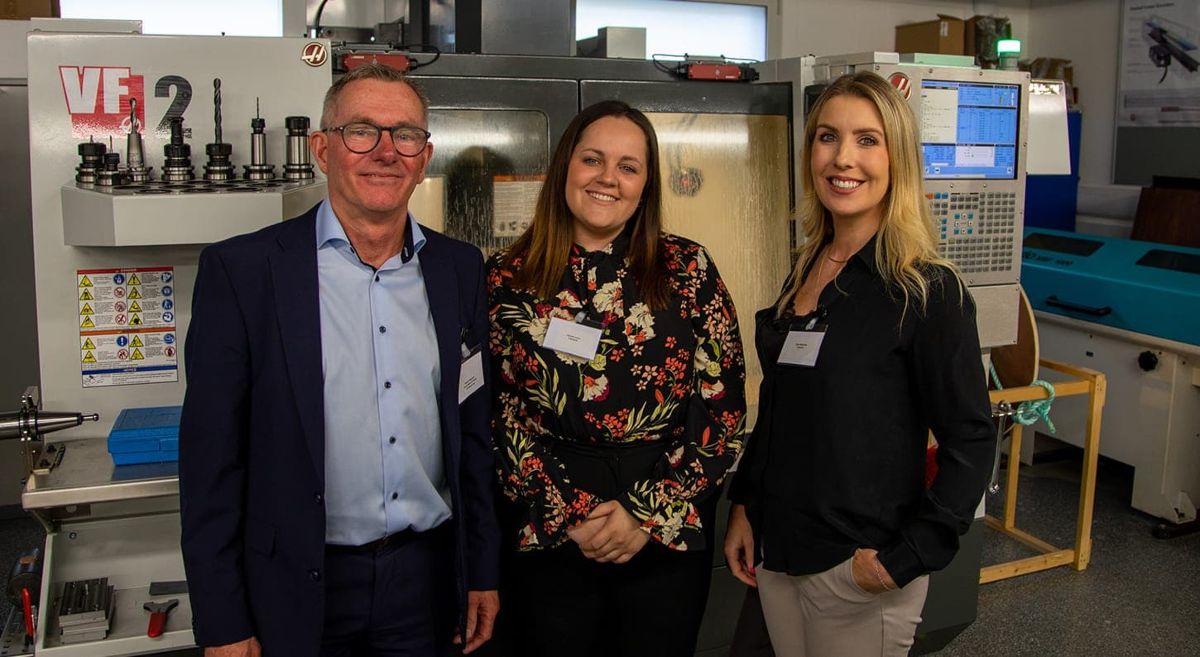 Male with two females pictured in engineering workshop