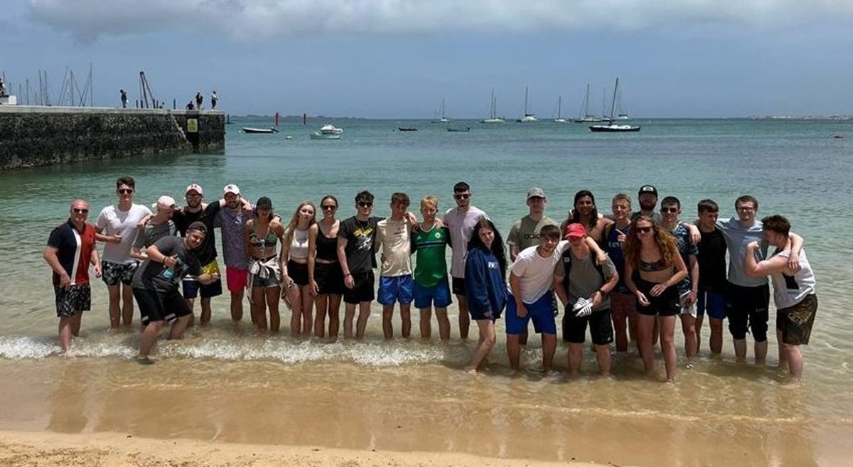 Sports students paddling in the sea