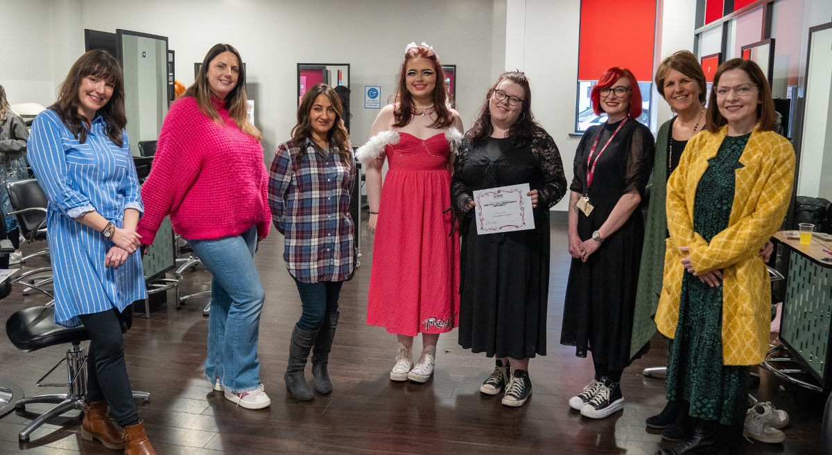 model Ellie Wood, in the style created by Toni Harper-Mclaughlin with judges and staff 