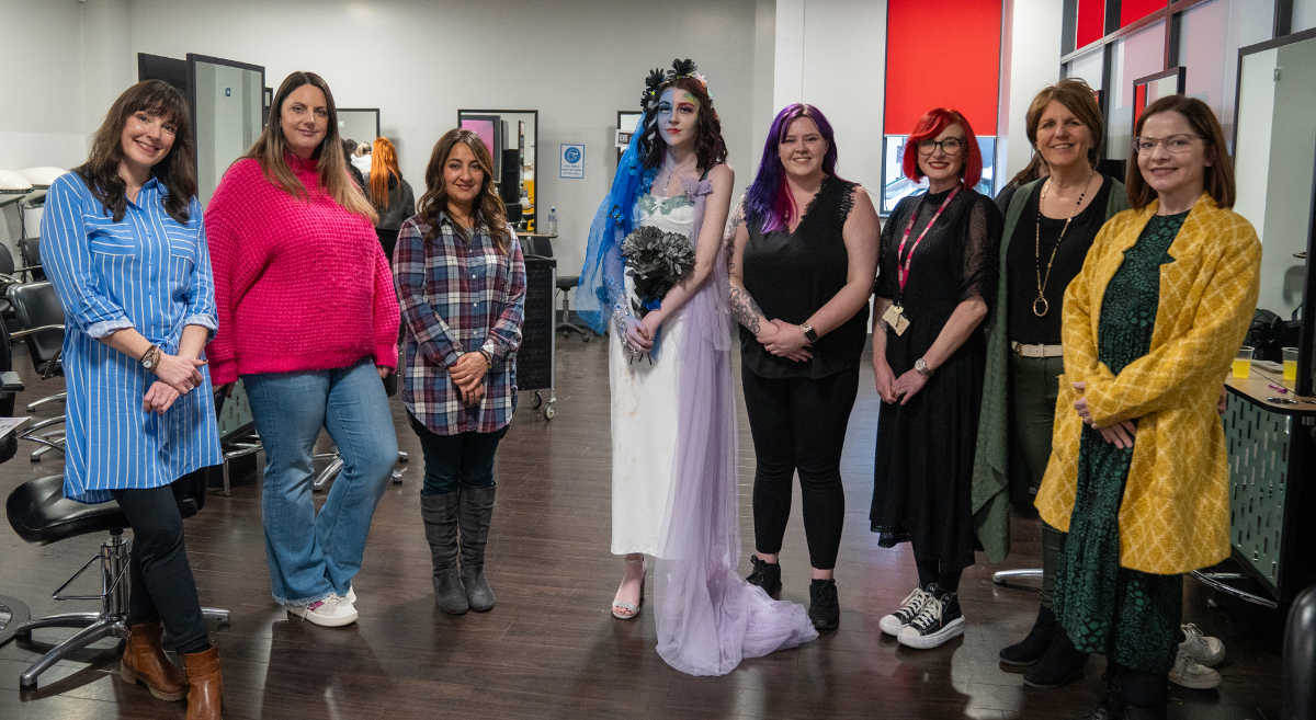 Second place winner Caroline Parks with model Nikita Isles, judges and SERC staff